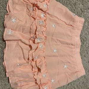 Peach mini skirt with cute stars on them